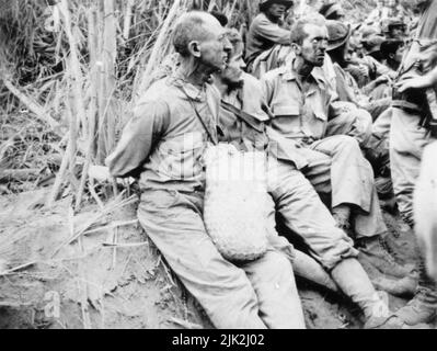 On the Bataan Death March these prisoners have their hands tied behind their backs. The March of Death in the Philippines was about May 1942, from Bataan to Cabanatuan, the prison camp Stock Photo