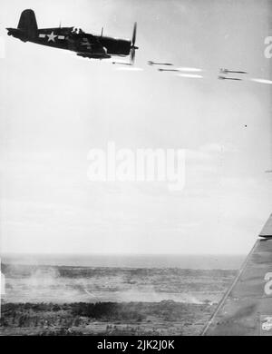 A Vought F4 Corsair fighter firing its rockets during the invasion of Okinawa during the Second World War Stock Photo