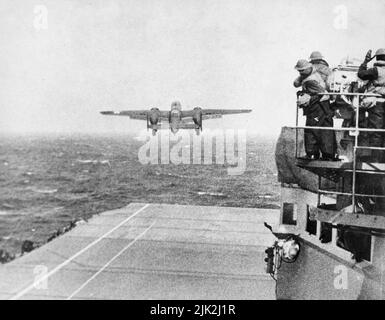 A North American B-25 Mitchell taking  off from the deck of the USS Hornet on its way to take part in first U.S. air raid on Japan. Doolittle Raid, April 1942. Stock Photo