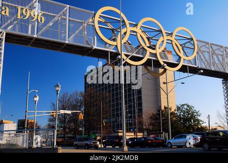 The Olympic rings hang over a busy street in Atlanta, a relic of when the city hosted the 1996 Games Stock Photo