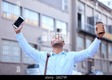 Can this day get any better. a young businessman cheering in excitement. Stock Photo