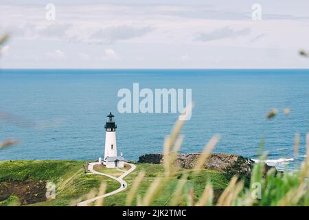 Scenic lighthouse on ocean's coast. Yaquina head, Oregon, USA Stock Photo