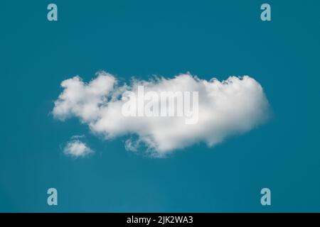 Single cloud in deep blue sky looks like whale in ocean, dream like cloudscape, daydreaming concept Stock Photo