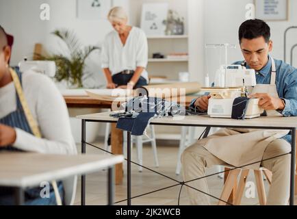 Fashion designer, young man and creative student in a workshop to stitch clothes. Factory worker, tailor and apprentice learning sewing machine skills Stock Photo