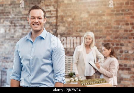 Happy, successful architect or construction manager satisfied with 3D building model and blueprint presentation meeting. Inspectors reviewing new Stock Photo