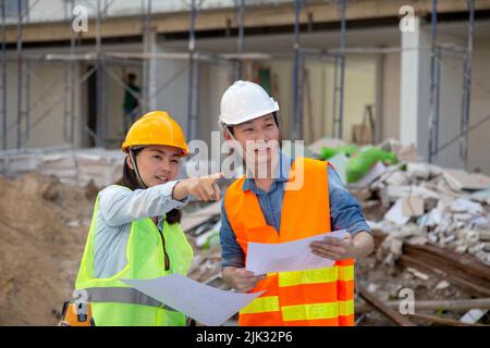Engineer manager inspects construction sites and checking blueprints at building townhome project Stock Photo