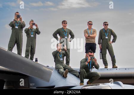 The Mildenhall boys watching their colleagues display from the roof of a V-22 Osprey. Stock Photo