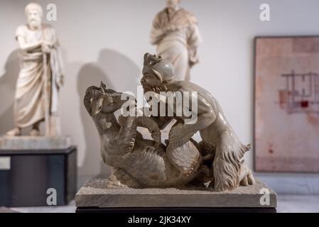 NAPLES, ITALY - MAY 06, 2022 - Statue of the mythologic Faun going for a goat, Southern Italy Stock Photo