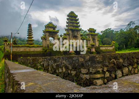 hindu temple ruins of Pura Hulun Danu at the Tamblingan lake, Bali, Indonesia Stock Photo