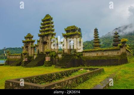 hindu temple ruins of Pura Hulun Danu at the Tamblingan lake, Bali, Indonesia Stock Photo