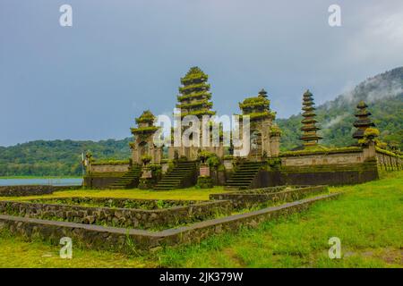 hindu temple ruins of Pura Hulun Danu at the Tamblingan lake, Bali, Indonesia Stock Photo