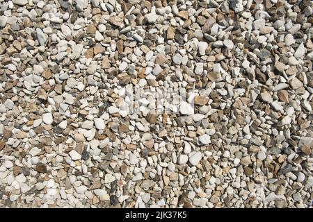 Small multi-colored stones as background. Abstract natural texture. Stones pattern. Stock Photo