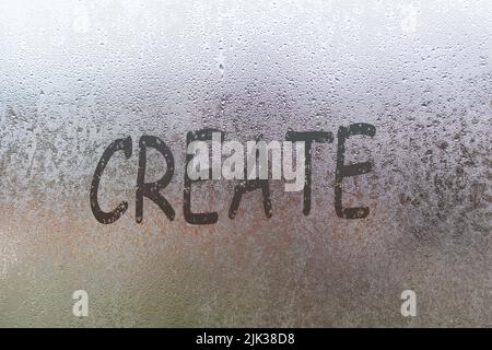 Handwritten lettering create on misted glass on window with raindrops, concept of full life and motivation Stock Photo