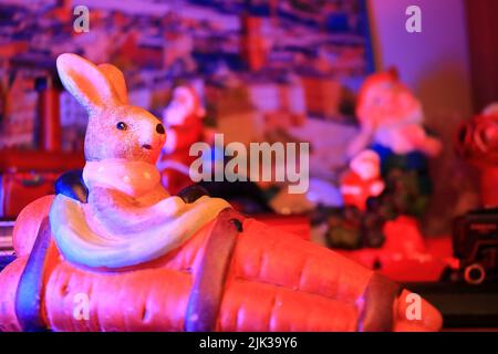 Rabbit statue decoration, blurred background. background under red light. Stock Photo