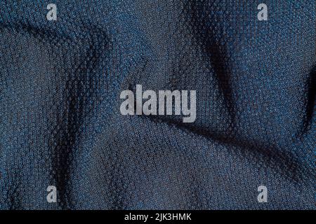 Macro Photo of dark blue fabric texture background. Pattern of dark woven clothing material. High quality photo Stock Photo