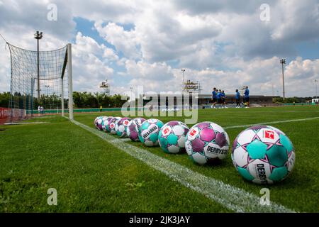 Illertissen, Germany. 30th July, 2022. Soccer: DFB Cup, FV Illertissen - 1. FC Heidenheim, 1st round, Vöhlin Stadium. Illertissen's players inspect the pitch behind the match balls before the game. Credit: Stefan Puchner/dpa - IMPORTANT NOTE: In accordance with the requirements of the DFL Deutsche Fußball Liga and the DFB Deutscher Fußball-Bund, it is prohibited to use or have used photographs taken in the stadium and/or of the match in the form of sequence pictures and/or video-like photo series./dpa/Alamy Live News Stock Photo