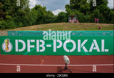 Illertissen, Germany. 30th July, 2022. Soccer: DFB Cup, FV Illertissen - 1. FC Heidenheim, 1st round, Vöhlin Stadium. Heidenheim's fans are seated behind the DFB gang on the visitors' mound. Credit: Stefan Puchner/dpa - IMPORTANT NOTE: In accordance with the requirements of the DFL Deutsche Fußball Liga and the DFB Deutscher Fußball-Bund, it is prohibited to use or have used photographs taken in the stadium and/or of the match in the form of sequence pictures and/or video-like photo series./dpa/Alamy Live News Stock Photo
