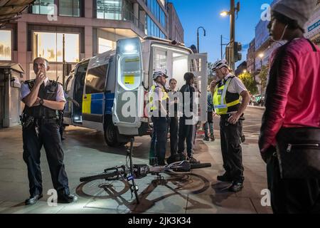 London, UK. 29th July, 2022. Crime scene arrest on Oxford Street. Police detain and arrest a youth on Friday evening, Oxford Street. Credit: Guy Corbishley/Alamy Live News Stock Photo