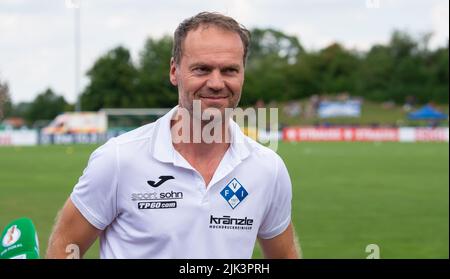 Illertissen, Germany. 30th July, 2022. Soccer: DFB Cup, FV Illertissen - 1. FC Heidenheim, 1st round, Vöhlin Stadium. Illertissen coach Marco Konrad smiles. Credit: Stefan Puchner/dpa - IMPORTANT NOTE: In accordance with the requirements of the DFL Deutsche Fußball Liga and the DFB Deutscher Fußball-Bund, it is prohibited to use or have used photographs taken in the stadium and/or of the match in the form of sequence pictures and/or video-like photo series./dpa/Alamy Live News Stock Photo