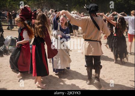 Cologne, Germany. 29th July, 2022. Visitors take part in a dance class at the medieval festival 'Spectaculum 2022'. Credit: Marius Becker/dpa/Alamy Live News Stock Photo