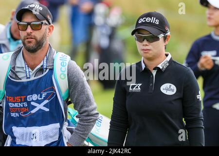Irvine, UK. 30th July, 2022. The third round of the Trust Golf Women's Scottish Golf took place with 75 players making the cut. Heavy overnight rain from Friday into Saturday made for a softer and more testing course. Eun-Hee Ji with her caddie. Credit: Findlay/Alamy Live News Stock Photo