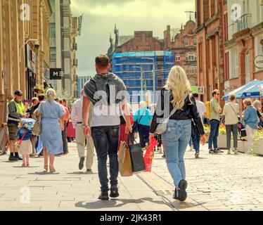 Glasgow, Scotland, UK  July 30th  2022. UK  Weather: Merchant City Festival Saturday saw a changeable day as performers mixed with tourists and locals amongst the bars and restaurants on Wilson street. Credit Gerard Ferry/Alamy Live News Stock Photo