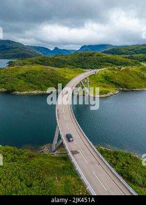 Aerial view of Kylesku Bridge crossing Loch a Chàirn Bhàin on North Coast 500 tourist route, Sutherland, Scotland Stock Photo