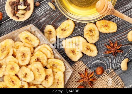 banana chips on wood background Stock Photo