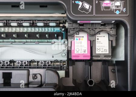 HP ink cartridge installed in printer Stock Photo