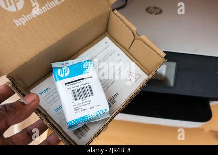 HP ink delivered in cardboard package as part of subscription printing Stock Photo