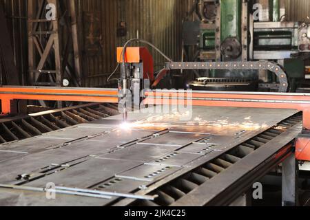 Laser cutting of metal. Automated machine for precise metal cutting. Plasma cuts steel. The machine is a robot Stock Photo