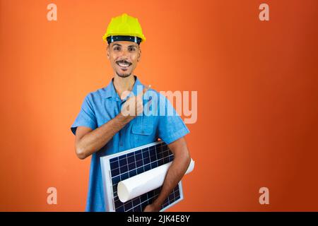 Engineer Holding Photovoltaic Solar Panel. Stock Photo