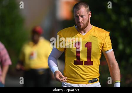 Ashburn, VA, USA. 30th July, 2022. Washington Commanders quarterback Carson Wentz (11) walks to the Washington Commanders Training Camp practice at the INOVA Sports Performance Center in Ashburn, Va. Reggie Hildred/CSM/Alamy Live News Stock Photo