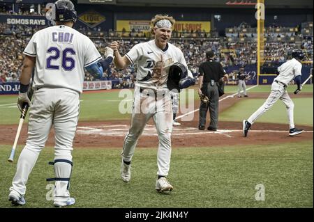 Tampa, United States. 30th July, 2022. Tampa Bay Rays' Ji-Man Choi (26) congratulates Taylor Walls after Walls scored on Rene Pinto's RBI-double during the second inning against the Cleveland Guardians at Tropicana Field in St. Petersburg, Florida on Saturday, July 30, 2022. Photo by Steve Nesius/UPI Credit: UPI/Alamy Live News Stock Photo