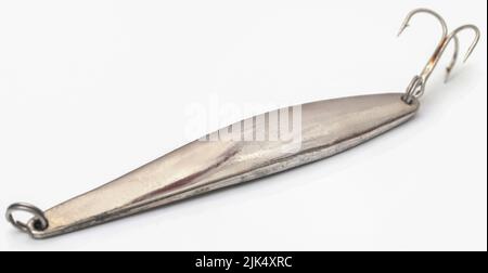 Sea fishing old metal lure for Cod over white background Stock Photo