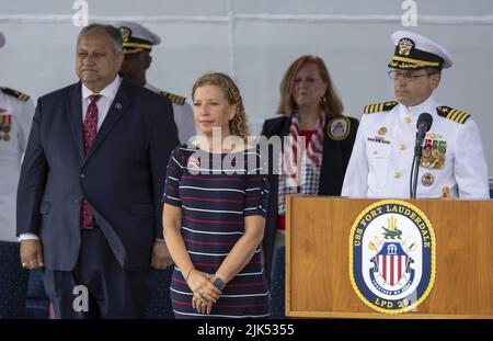 Fort Lauderdale, Florida, USA. 30th July, 2022. (L-R) Secretary of the Navy the Honorable Carlos Del Toro, U.S. Rep. Debbie Wasserman Schultz (FL-23) and Commanding Officer, Capt. James Quaresimo stand during the National Anthem at the commissioning ceremony for the USS Fort Lauderdale (LPD 28), Port Everglades, Florida.The USS Fort Lauderdale (LPC28) is a San Antonio-class amphibious transport dock ship. Credit: UPI/Alamy Live News Stock Photo