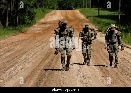 July 14, 2022 - Fort Stewart, Georgia, USA - U.S. Army Soldiers assigned to 703rd Brigade Support Battalion, 2nd Armored Brigade Combat Team, 3rd Infantry Division, conduct a tactical footmarch in preparation for the upcoming XVIII Airborne Corps Best Squad Competition on Fort Stewart, Georgia, July 14, 2022. Squads from throughout the XVIII Airborne Corps will compete in a Best Squad Competition July 25-28, 2022, at Fort Stewart to determine the squad that will go on to represent the Corps during the upcoming Forces Command Best Squad Competition. (Credit Image: © U.S. Army/ZUMA Press Wire Se Stock Photo