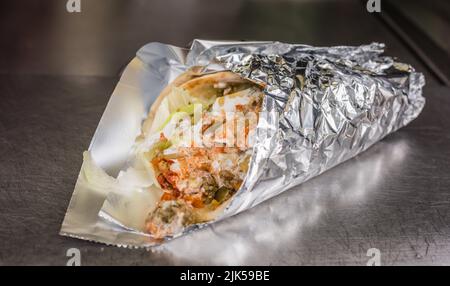 Gyro wrapped up to eat on the run in Manhattan. Stock Photo