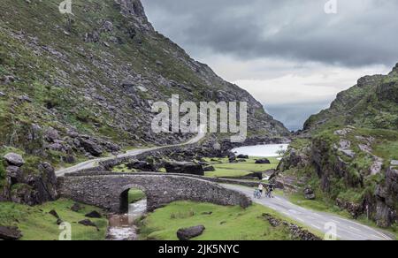 Gap of Dunloe, Killarney, Ireland. 30th July, 2022. A pair of cyclists taking their time to experience the beauty of the Gap of Dunloe, killarney, Co. Kerry, Ireland.  - Credit; David Creedon / Alamy Live News Stock Photo