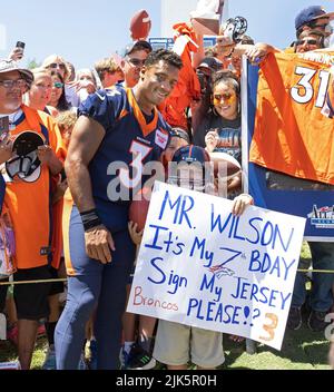 Englewood, Colorado, USA. 30th July, 2022. Denver Broncos QB RUSSELL WILSON signs autographs for fans after Training Camp practice Saturday afternoon. (Credit Image: © Hector Acevedo/ZUMA Press Wire) Stock Photo