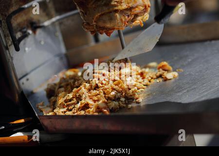 Meat roasted on a vertical spit before making a shawarma Stock Photo