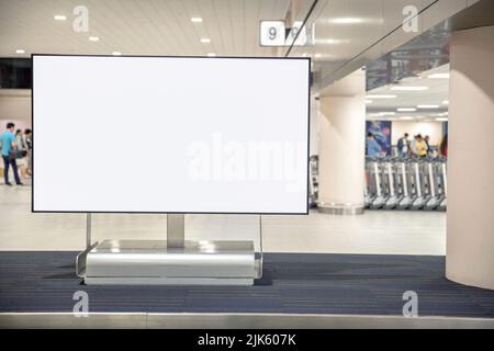 Digital Media blank advertising billboard in the airport , blank billboards public commercial with passengers, signboard for product advertisement des Stock Photo