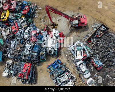 Junkyard Abandoned Cars Aerial View. Top Down View. Vehicle Demolition. Car Dump. Industrial Aerial Background. Stock Photo