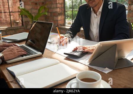 Architects working on construction project in office Stock Photo
