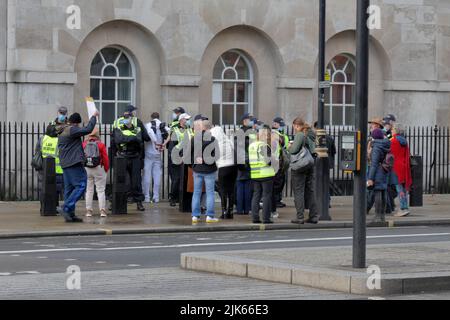London, UK - December 19, 2020: Protests against COVID-19 restrictions on Whitehall street Stock Photo