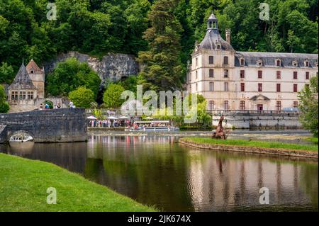 View of the Dronne river boardering the town hall (Mairie) of Brantôme en Périgord in the former abbey of Saint-Pierre, France Stock Photo