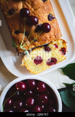 delicious sweet cake with cherries and a fresh cherry on the side. cherry pie. Stock Photo