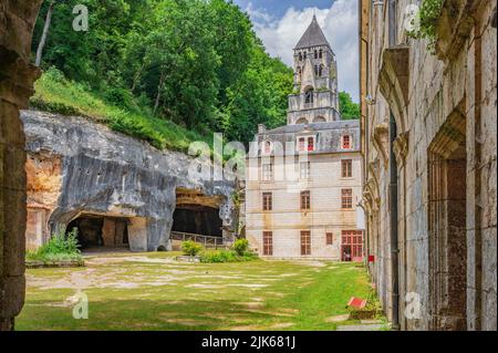 View of the Dronne river boardering the town hall (Mairie) of Brantôme en Périgord in the former abbey of Saint-Pierre, France Stock Photo