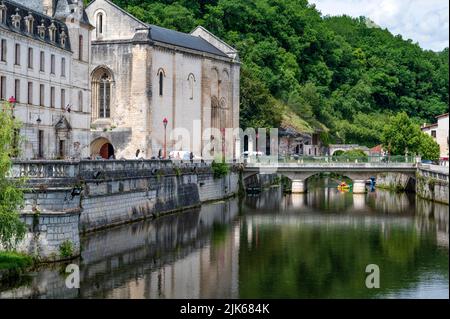 View of the Dronne river boardering the town hall (Mairie) of Brantôme en Périgord in the former abbey of Saint-Pierre, France Stock Photo