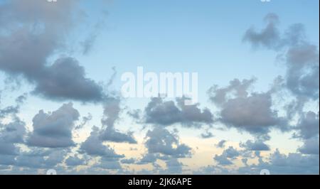 White, fluffy clouds in blue sky. Background from clouds Stock Photo